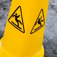 Caution wet floor, yellow warning sign.