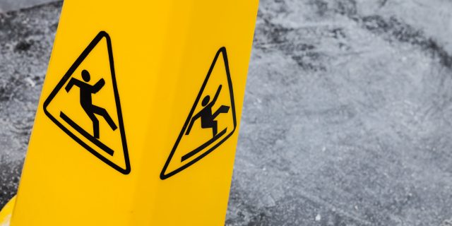 Caution wet floor, yellow warning sign.