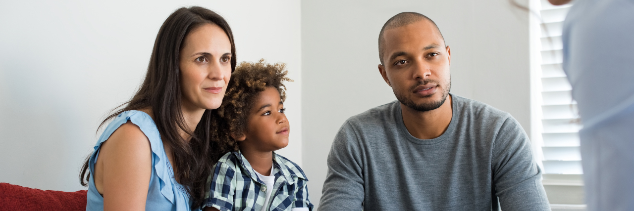 Advice for the Parent of a Newly Diagnosed Autistic Child Couple with child talking to family counselor.
