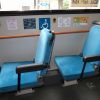 priority seats on a bus with the disability logo next to them