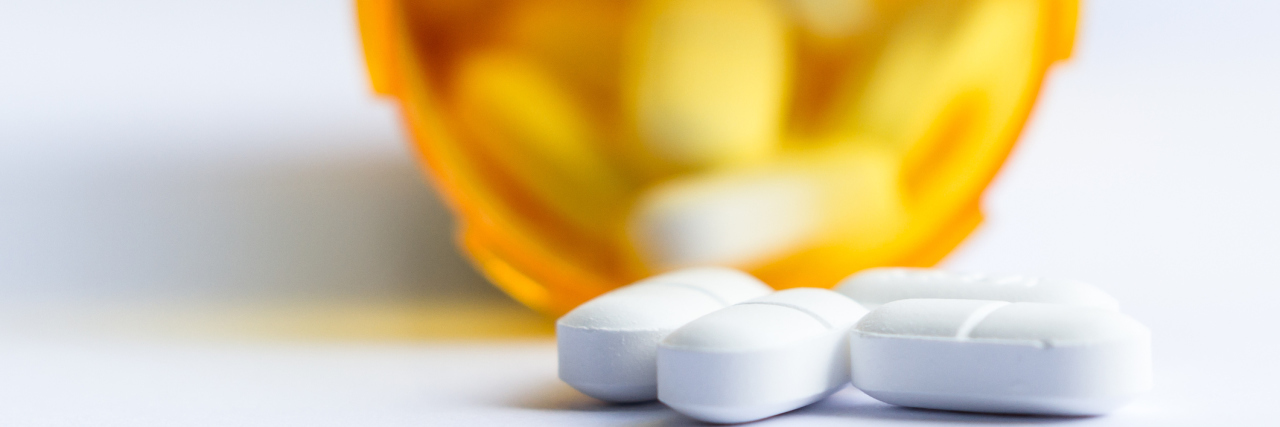 What the Opioid Crisis Is Like for Chronic Pain Patients prescription bottle with pills spilling out
