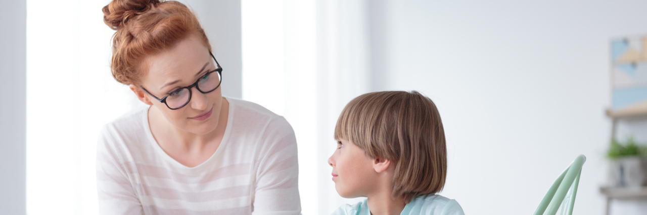 How I Talk to My Son About My Crohn’s Disease A mom talking to her young son.