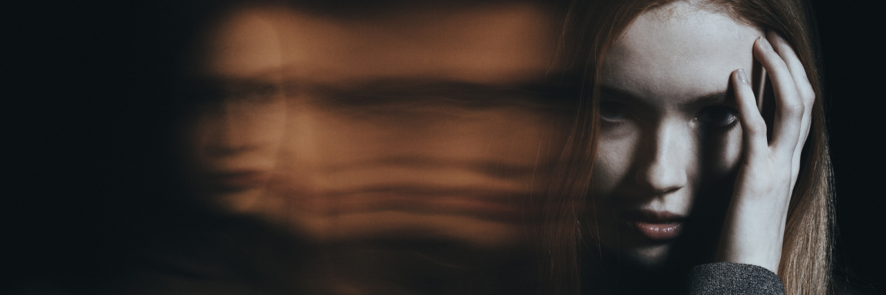 When You Feel Paranoid About Your Chronic Illness blurred photo of a woman looking worried