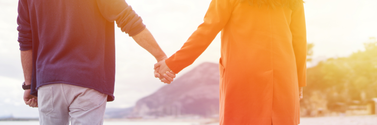 Relationships Between Two Autistic People Couple in love on the beach.