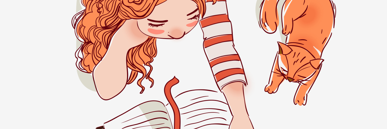 Growing Up With Dyslexia Girl reads a book with cat sitting beside her.