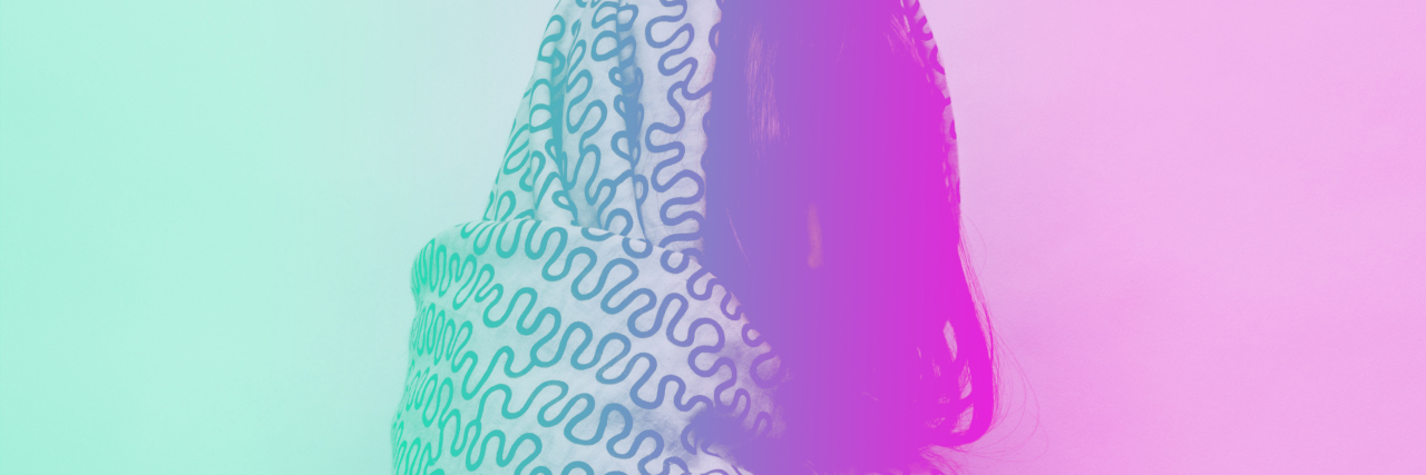 How Deep Pressure Stimulation Helped My Anxiety the girl wrapped herself in a blanket. the double exposure effect with green and purple gradient