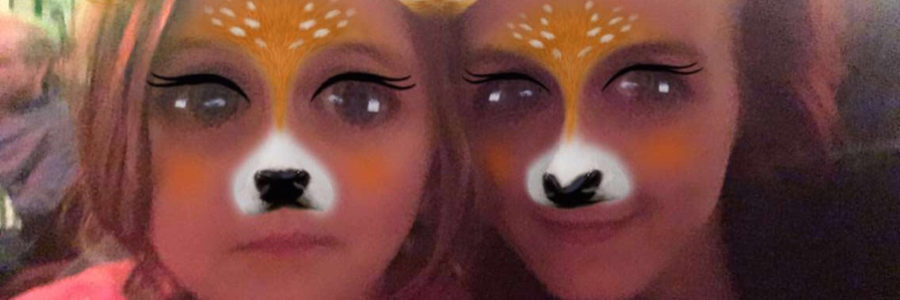 A photo of the writer and her daughter, while wearing the Snapchat deer filter.