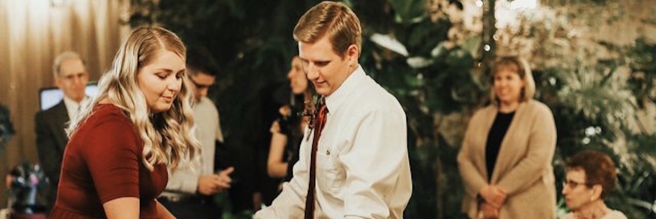 Why We Shouldn't Judge People for the Size They Wear A photo of the writer dancing with a man and a child at a wedding.