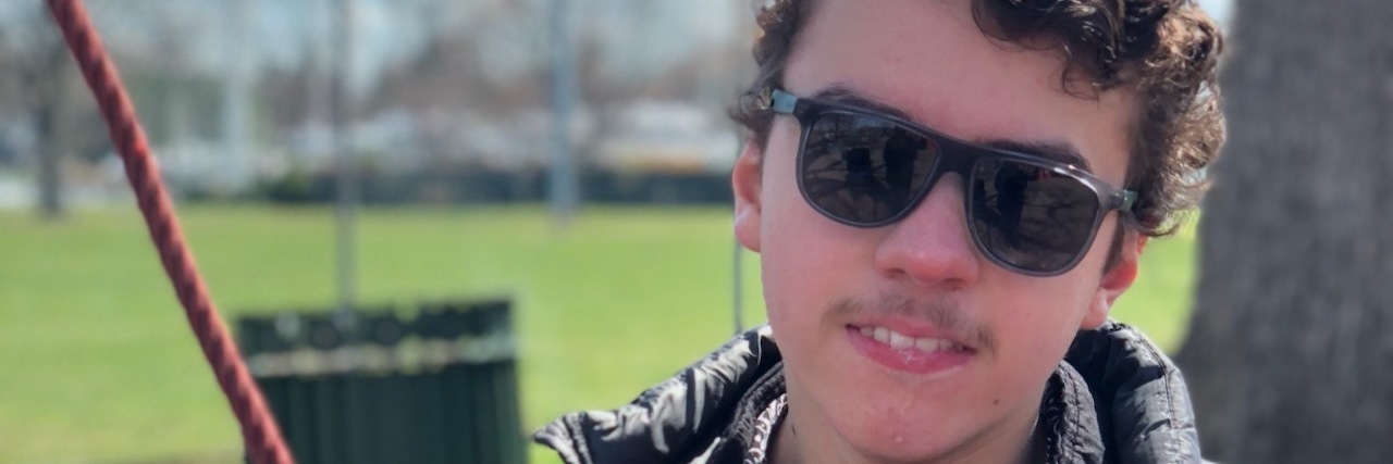 When a Woman Asked How I Knew if My Son With a Disability Was Excited Image of boy with a disability at a park