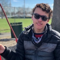Image of boy with a disability at a park