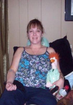Kristin, sitting with a stuffed animal 