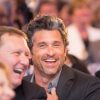 Patrick Dempsey with Bryan Neider CEO of Gatepath at table laughing