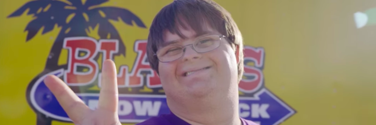 Blake Pyron, Man With Down Syndrome Running a Snow-Cone Business Blake Pyron posing in front of his Snow Shack truck, making the"peace" sign