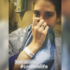 woman taking in a selfie in the hospital with the hashtag #crohnslife