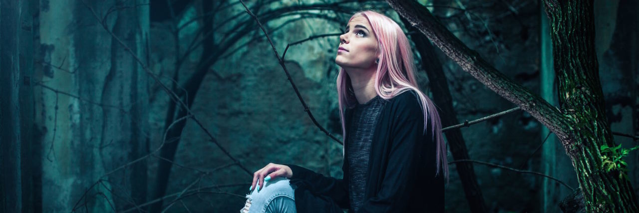 Having Borderline Personality Disorder Leaves Me Feeling Misunderstood woman looking up in forest