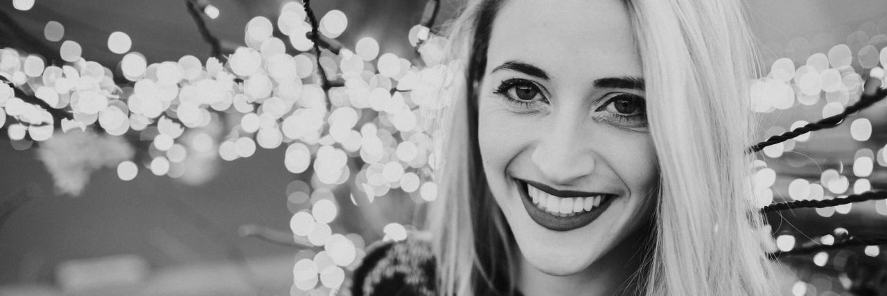 My Smile Hides the Fact That I'm Constantly Thinking About Suicide black and white photo of woman smiling