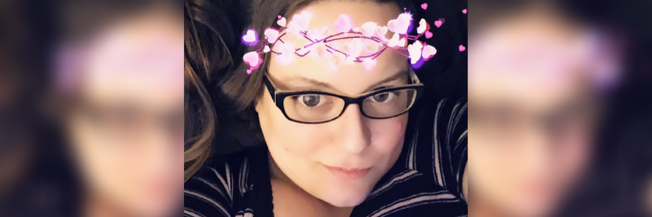 Feeling Beautiful With Snapchat Filters When My Illness Is Flaring selfie of a woman with a flower crown filter from snapchat