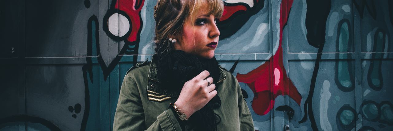 Doctors Didn't Understand Schizoaffective Disorder Diagnosis woman standing in front of colorful street art