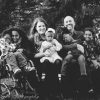 Black and white image of large family; family of 7, several kids with disabilities