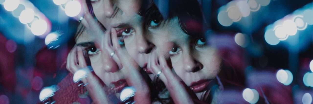When Depression Feels Like You Are Losing Parts of Your Identity woman's worried face refracted in kaleidoscope