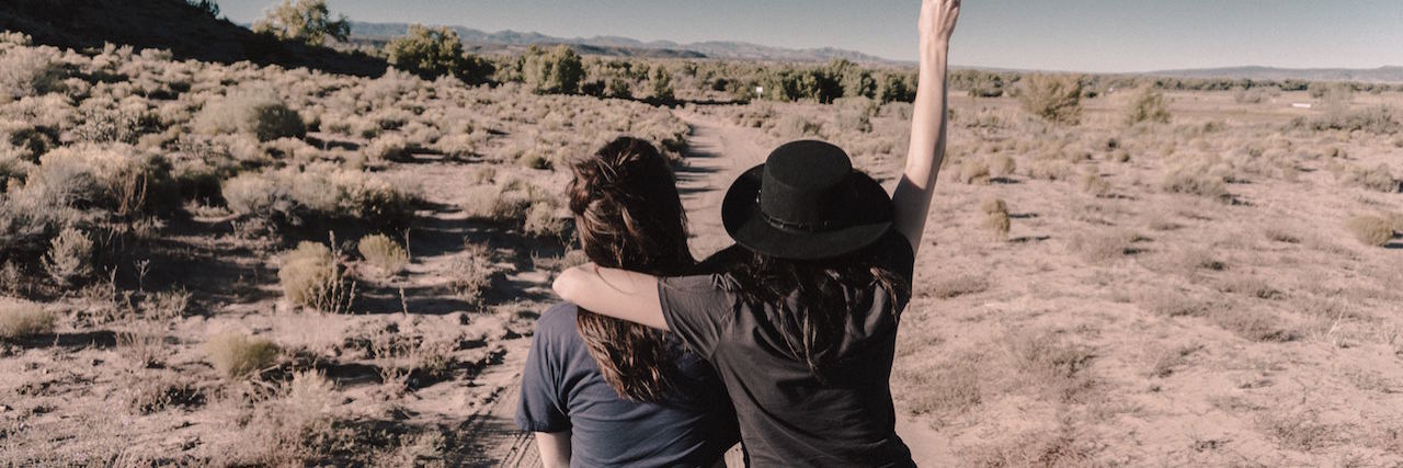6 Tangible Ways to Love Someone With a Mental Illness friends sitting on a car hugging