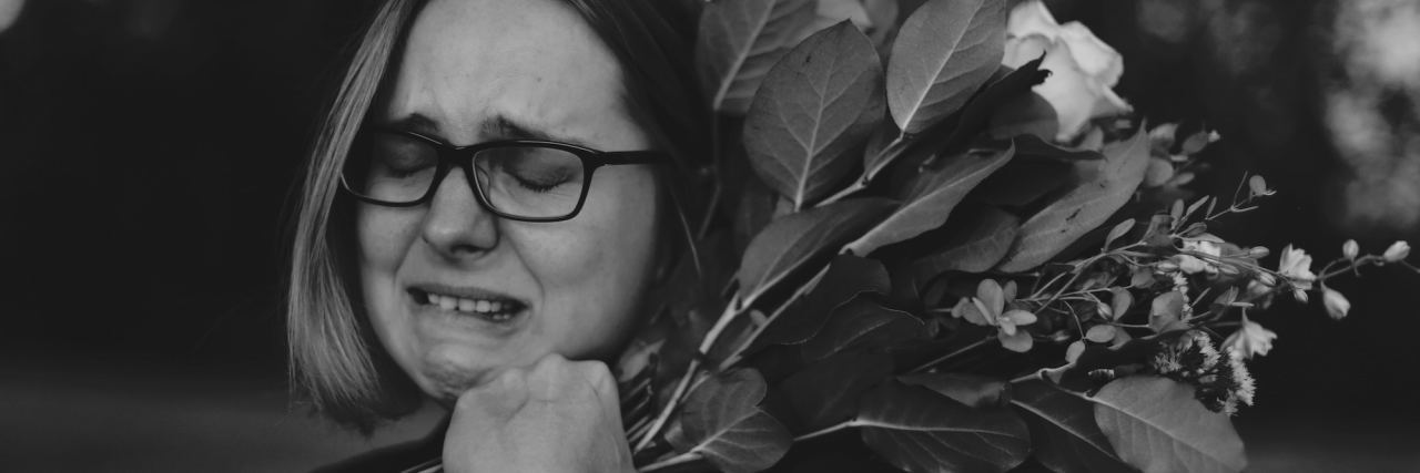 When Borderline Personality Disorder Makes You Cry All the Time woman crying with flowers