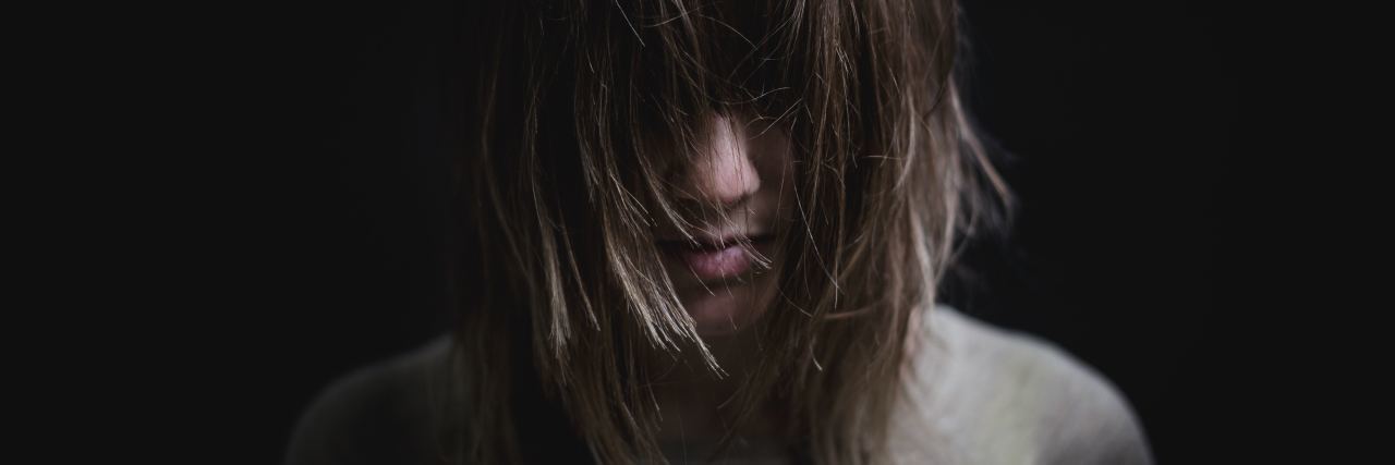 When Self-Harm Scars Make You Feel Ashamed woman with hair covering face