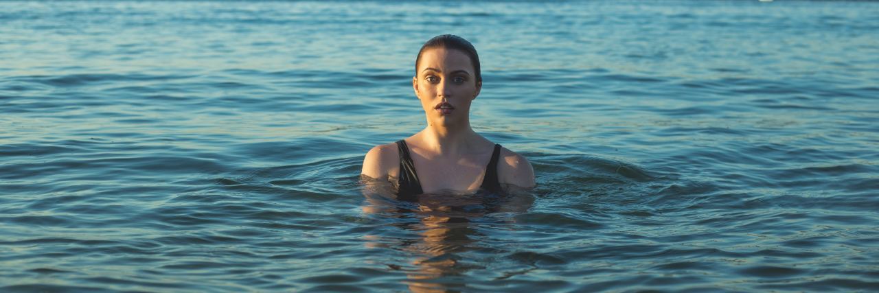 My Depression Is an Ocean, and I'm Just Trying to Stay Afloat woman in the middle of an ocean