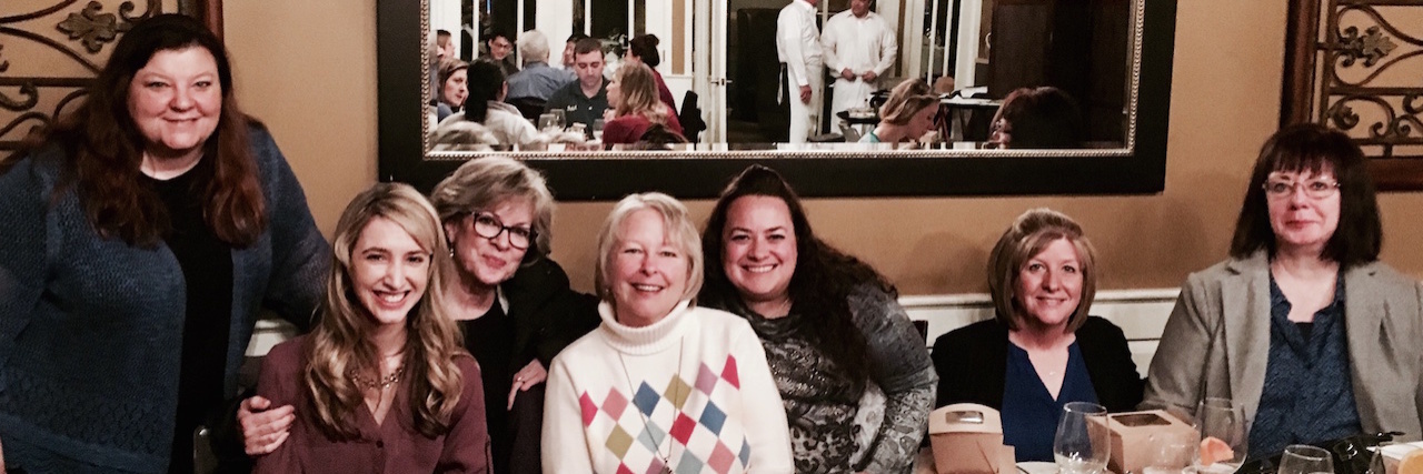 Managing on Your Health With Doctors and Nurses as a Team group of women sitting together in a restaurant and smiling