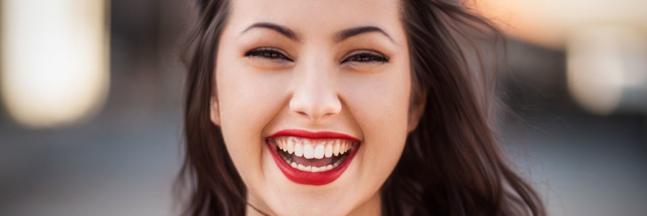 15 Mental Health Victories Worth Celebrating woman smiling