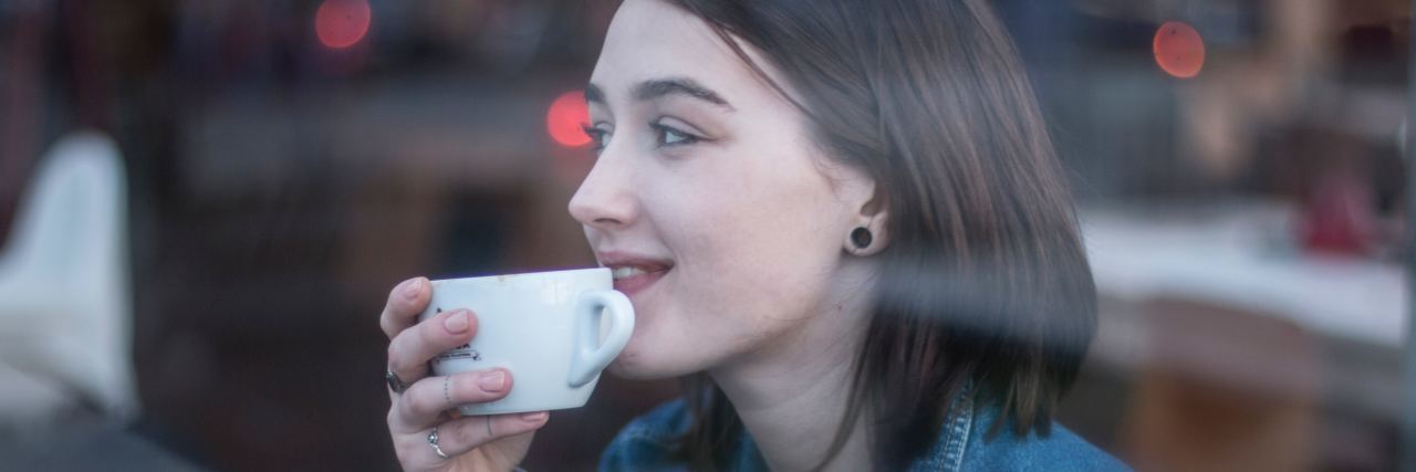 What I Wish Others Would Understand About Me Being Autistic woman drinking coffee