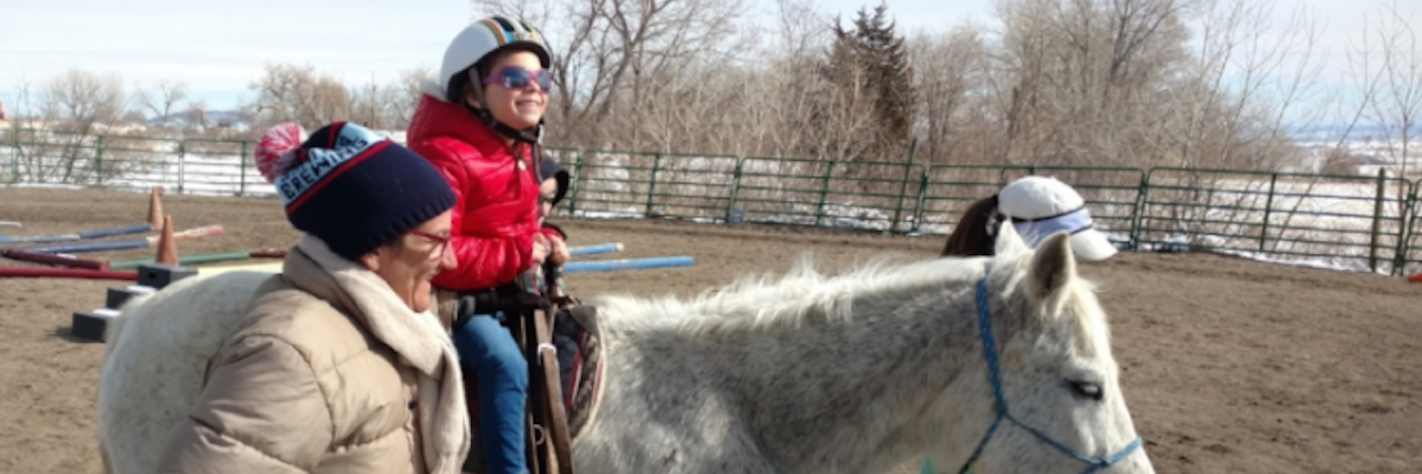 Parenting a Child With Batten Disease and Blindness mila on a horse