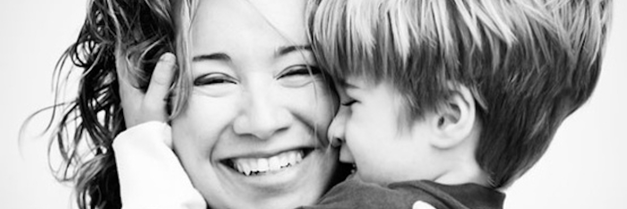 What My Mother Never Told Me About Raising My Child Black and white image of mother and child, close up.