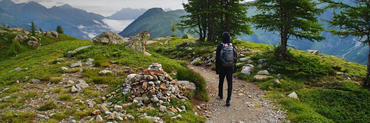 Where Do I Start in Therapy? woman walking along mountain path