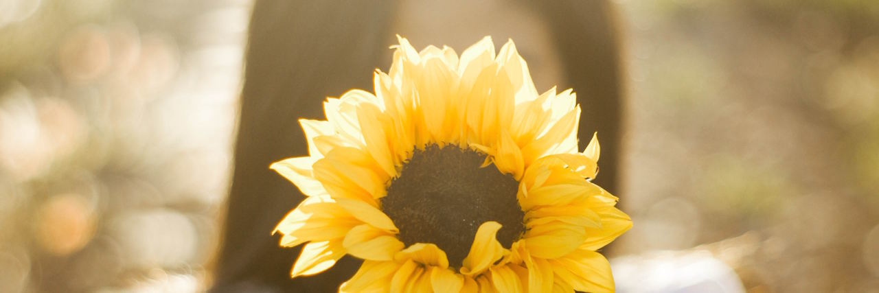 To the People Who Supported Me in Eating Disorder Recovery woman with sunflower