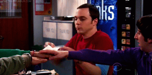 sheldon cooper putting a napkin over people hands before touching them