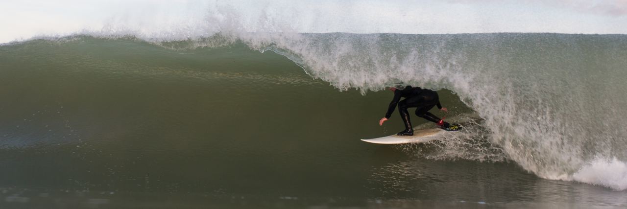 When Life Changes Cause You Intense Anxiety photo of surfer hidden by crashing wave