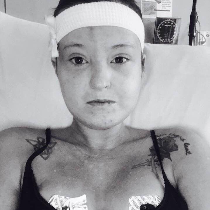 black and white photo of a woman in the hospital 
