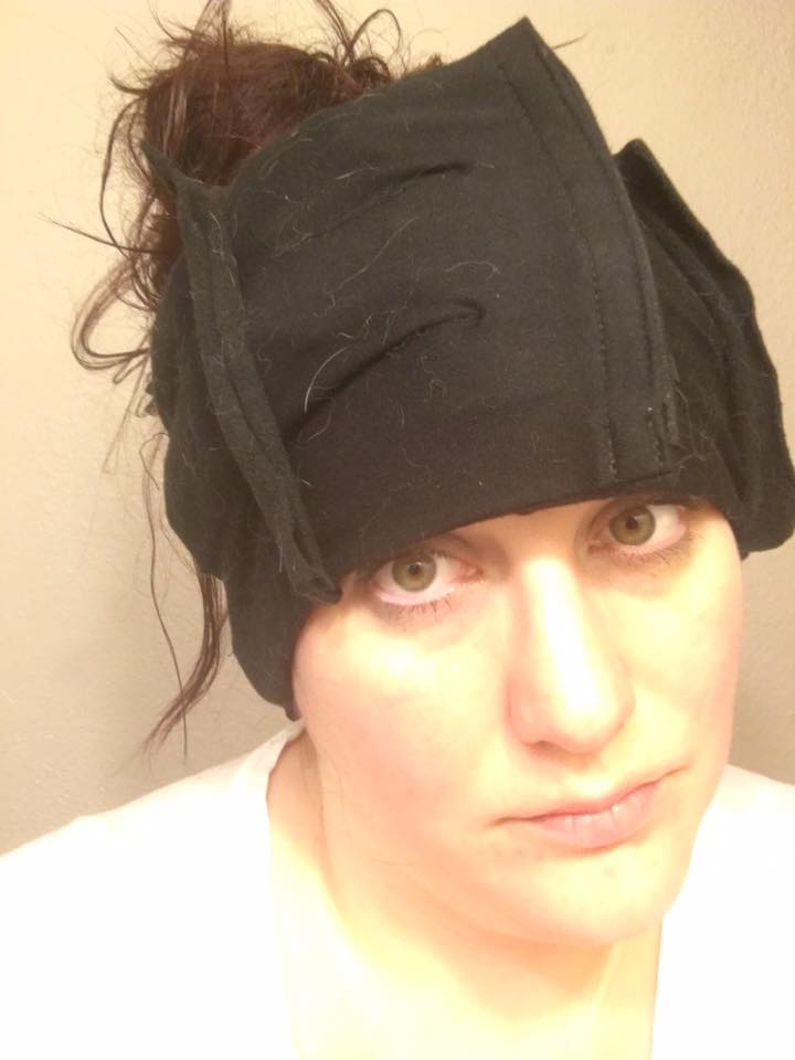 woman with an ice pack wrapped around her head