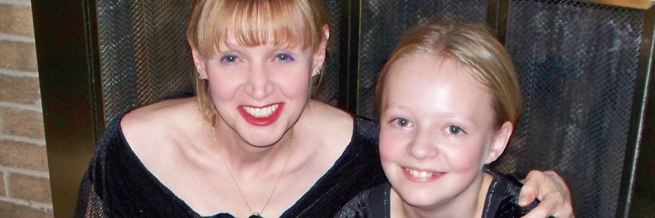 The Joys and Fears of Motherhood With Gastroparesis mom and daughter wearing matching black dresses