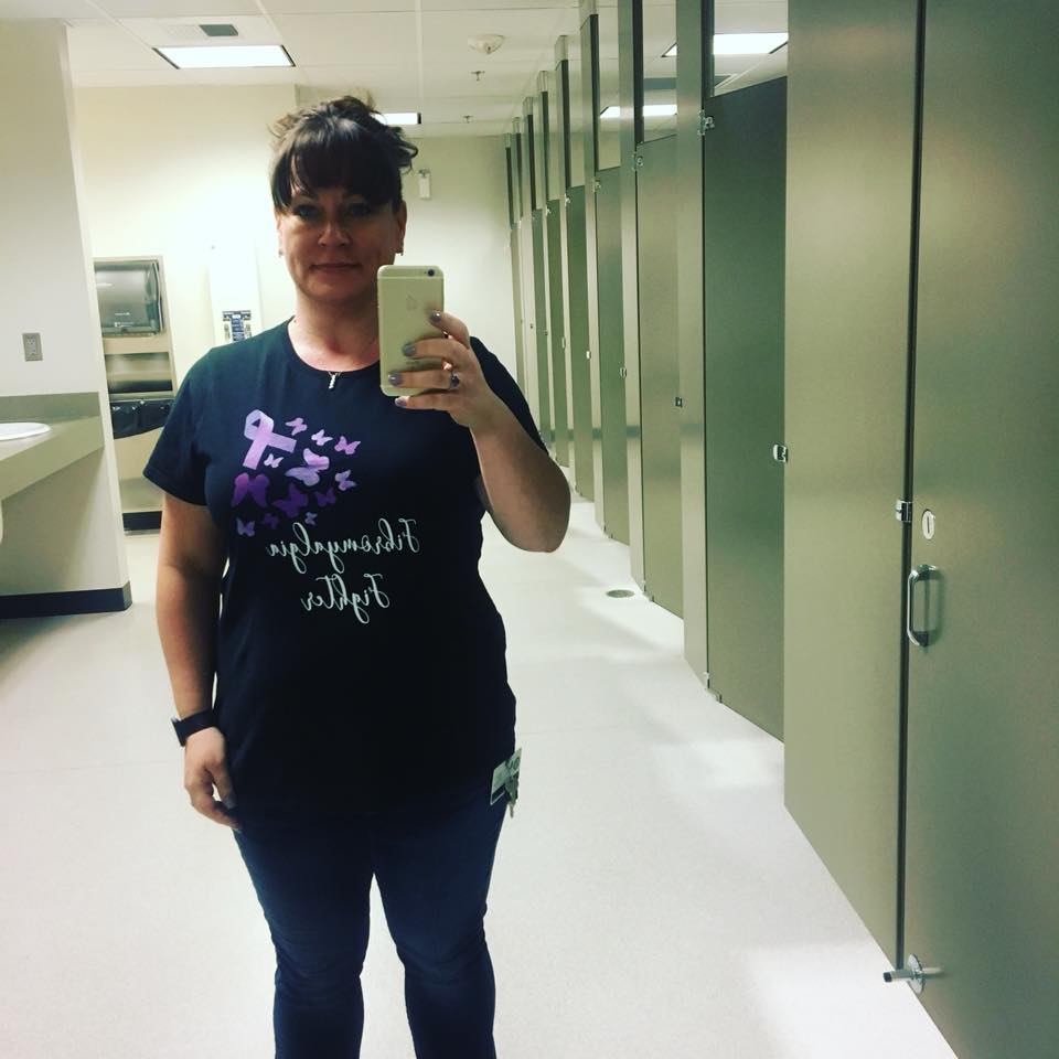 woman taking a selfie wearing a fibromyalgia awareness shirt