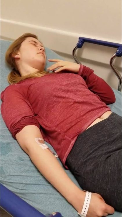 woman lying on gurney in hospital