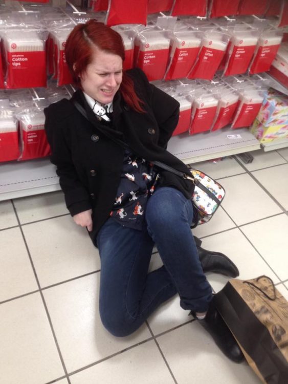 woman sitting on floor of target store