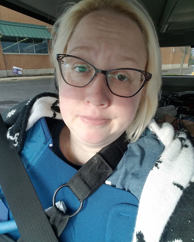 woman taking a selfie in her car