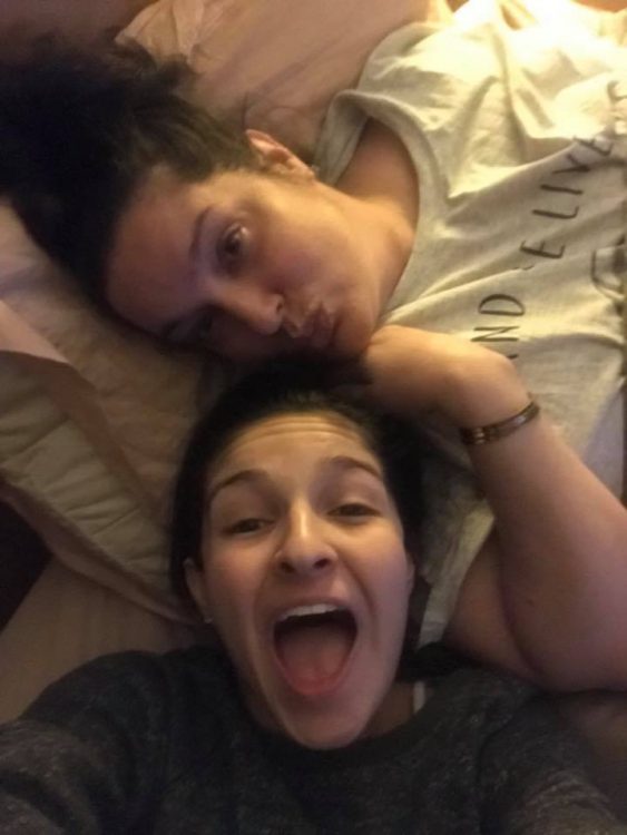 mom laying in bed with her daughter