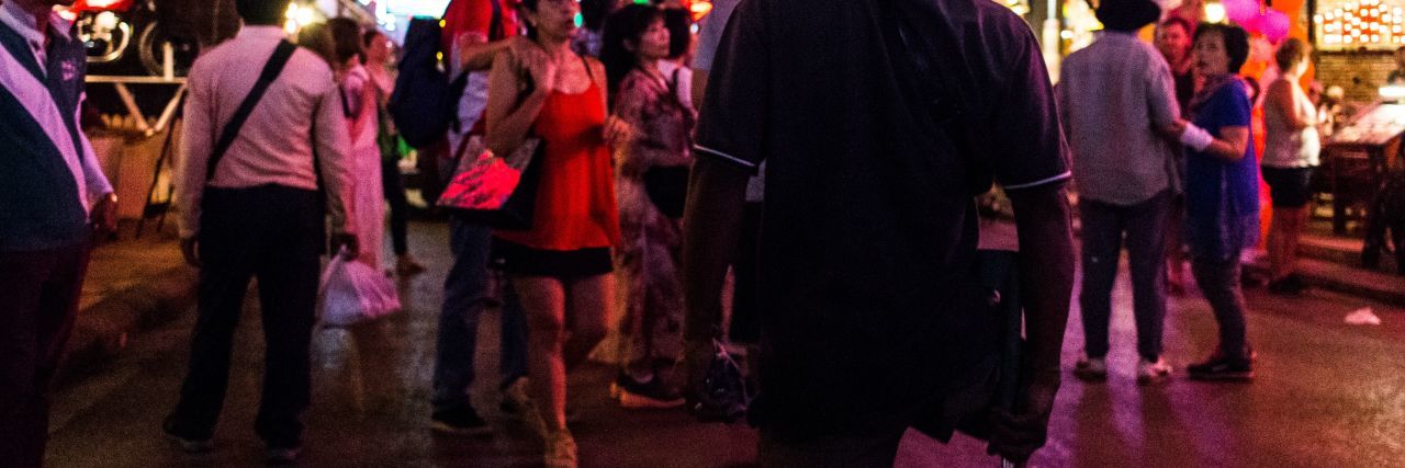 Life After Amputation From Land Mines in Cambodia Bel sells his jewelry in the market.