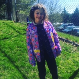 the author's daughter in a coat outside