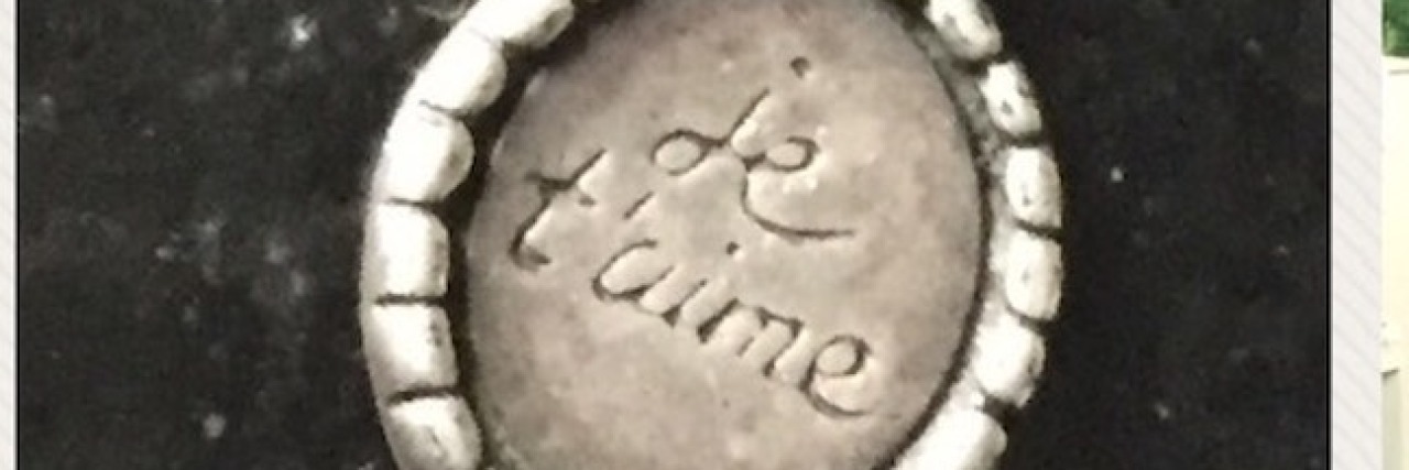 When My Son on the Autism Spectrum Felt So Alone He Attempted Suicide Three images. First the silver necklace with words, "j'tame" against black background. Picture of son looking at camera, close up. Picture of son wearing a special contraption around his face at a doctor's office.