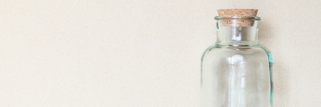 What to Do When Your 'Caregiver Jar' Is Running on Empty An old glass jar sitting on a shelf, empty.