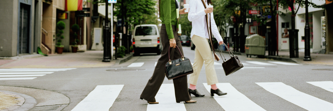 Feeling Confidence Walking With Arthritis Two women crossing city street.
